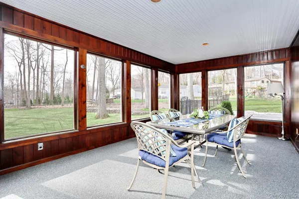 a dining room with furniture and windows