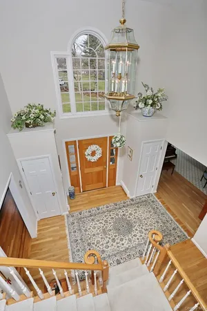 a view of a livingroom with workspace and a window
