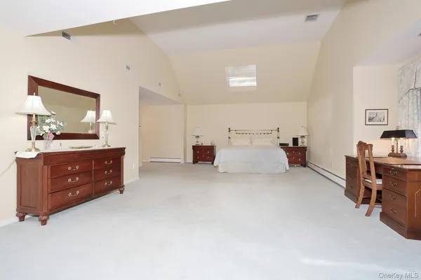 a spacious bathroom with a double vanity sink mirror double and shower