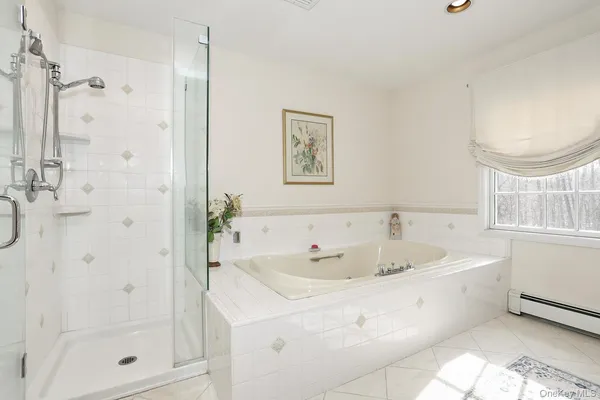 a spacious bathroom with a bathtub sink and a toilet