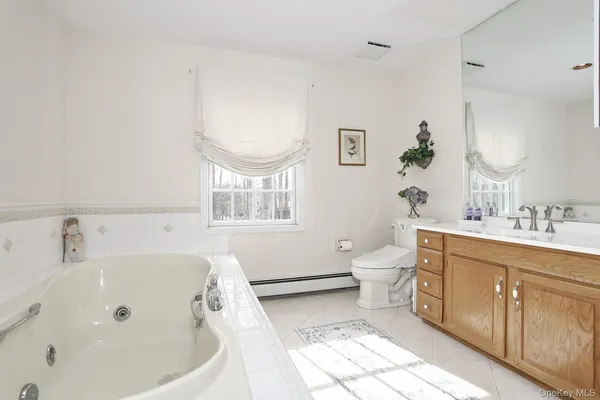 a bedroom with two beds and a window