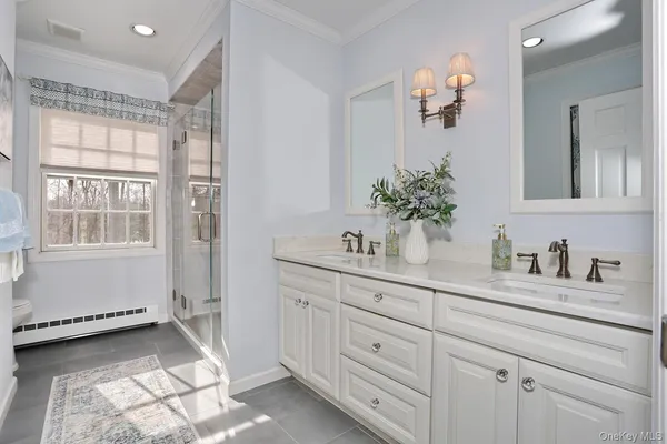 a bedroom with a bed a chair and a window