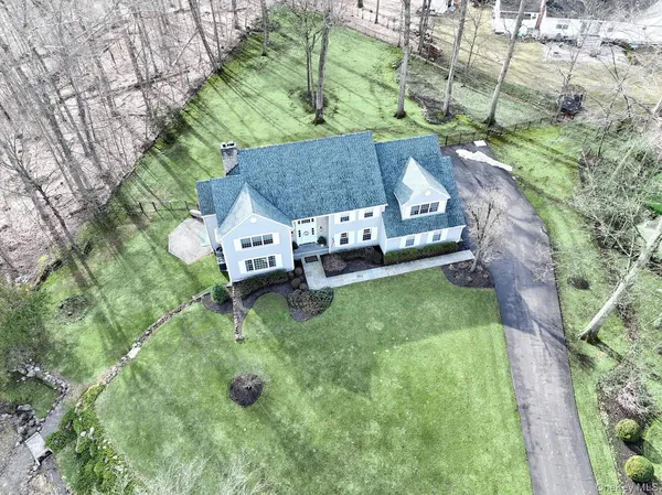 a house that has a tree in front of it