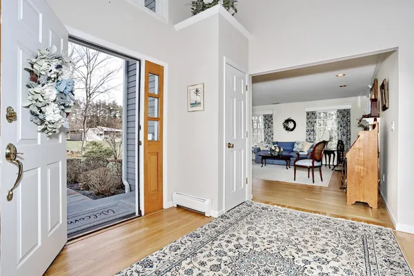 a living room with furniture and a table