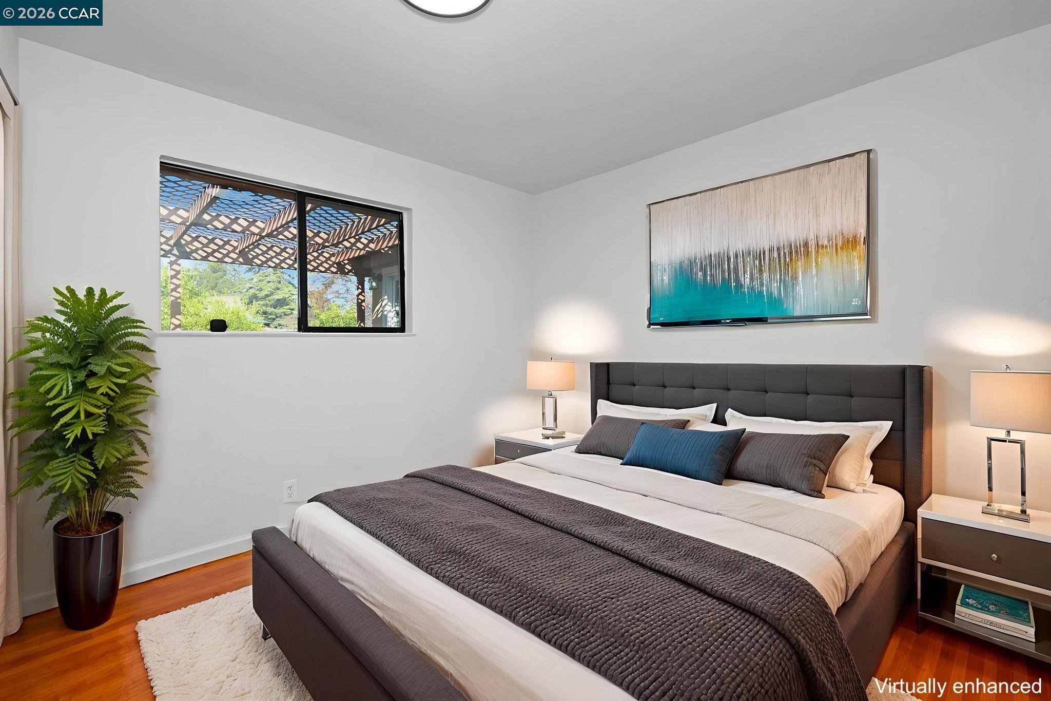 1921 Gilly Lane Concord, CA 94518 - Photo 12 of 29 a bedroom with bed and paintings on the wall