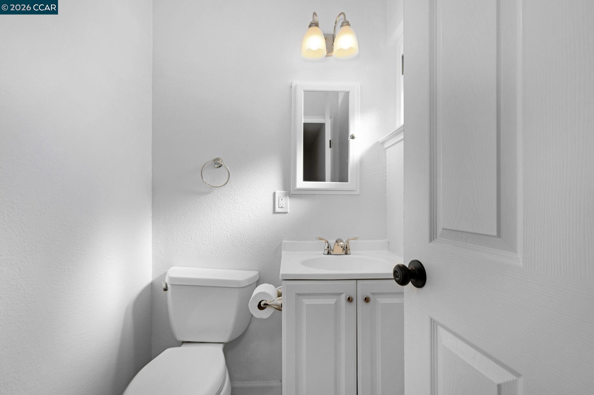 1921 Gilly Lane Concord, CA 94518 - Photo 17 of 29 a white toilet sitting next to a bathroom sink