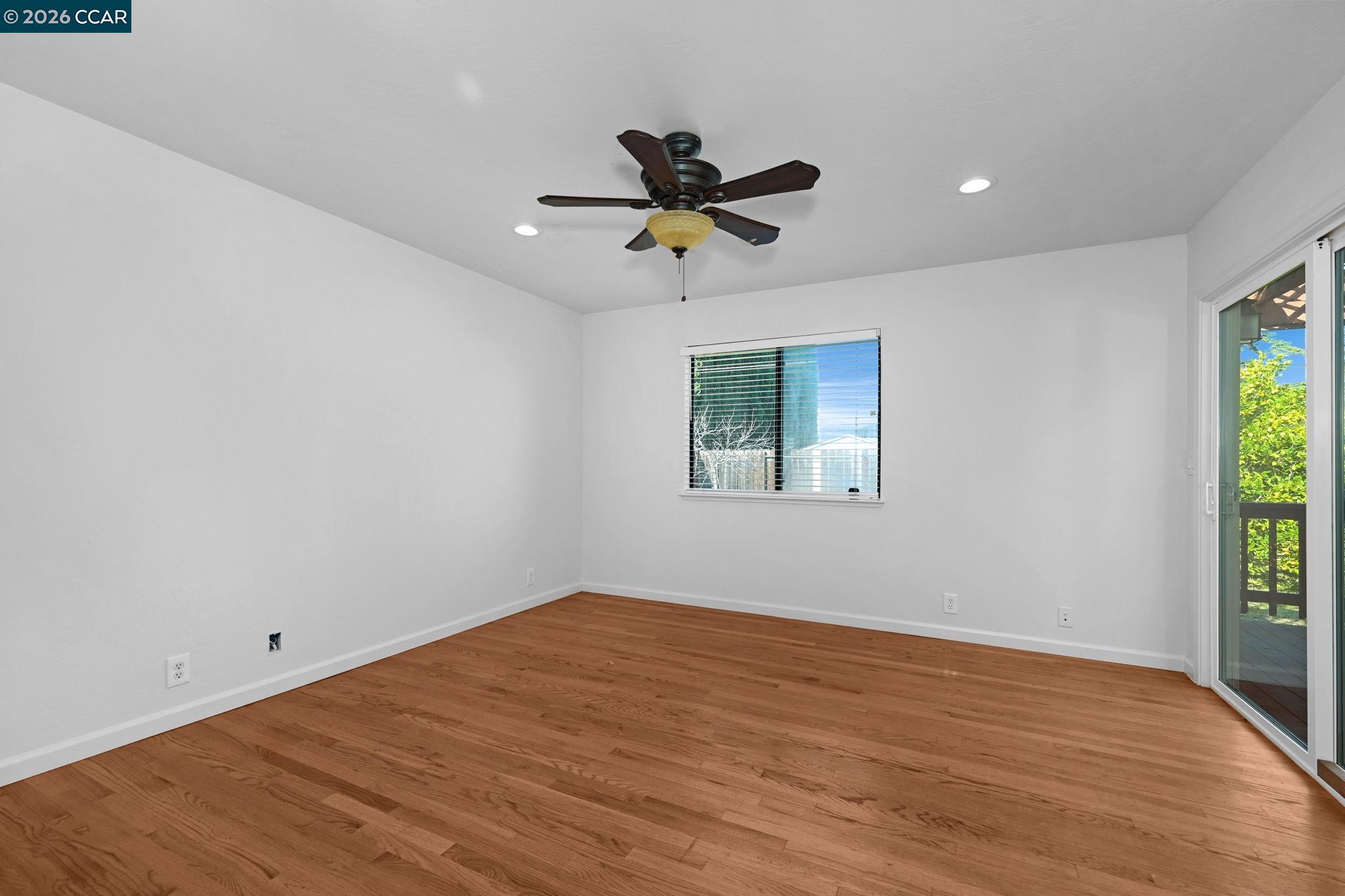 1921 Gilly Lane Concord, CA 94518 - Photo 19 of 29 wooden floor in an empty room with a window