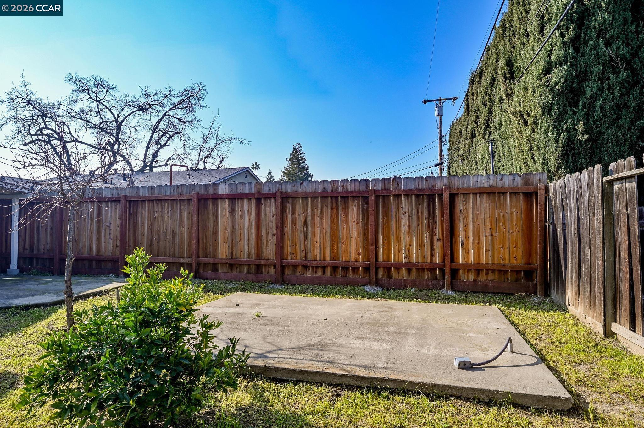 1921 Gilly Lane Concord, CA 94518 - Photo 26 of 29 a view of a backyard with wooden fence