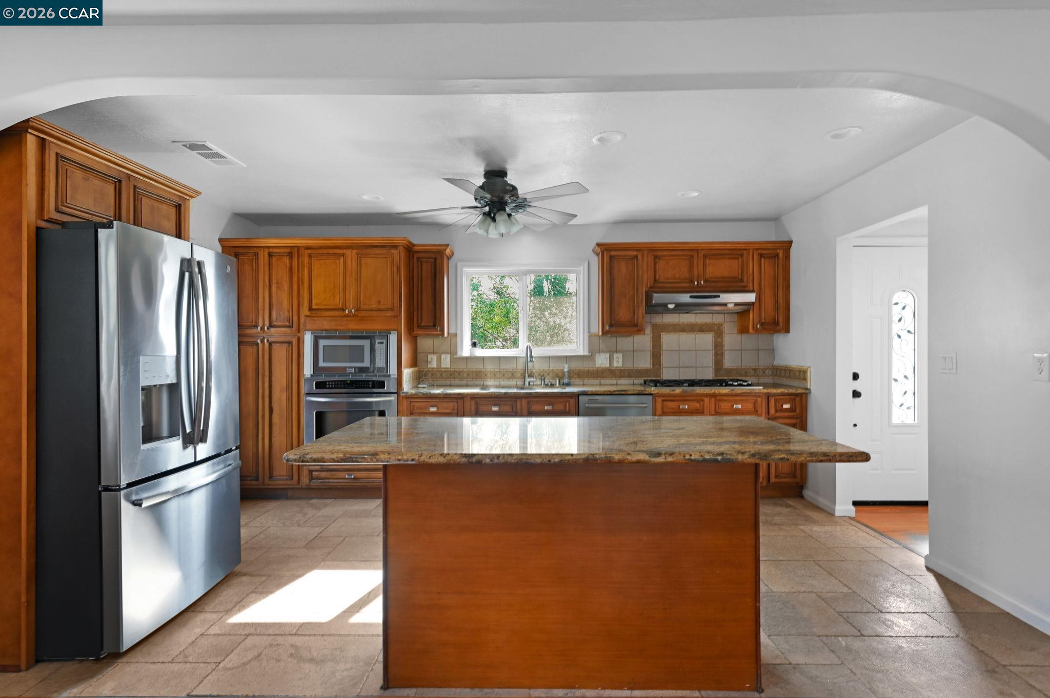 1921 Gilly Lane Concord, CA 94518 - Photo 4 of 29 a kitchen with stainless steel appliances granite countertop a refrigerator a stove and a sink