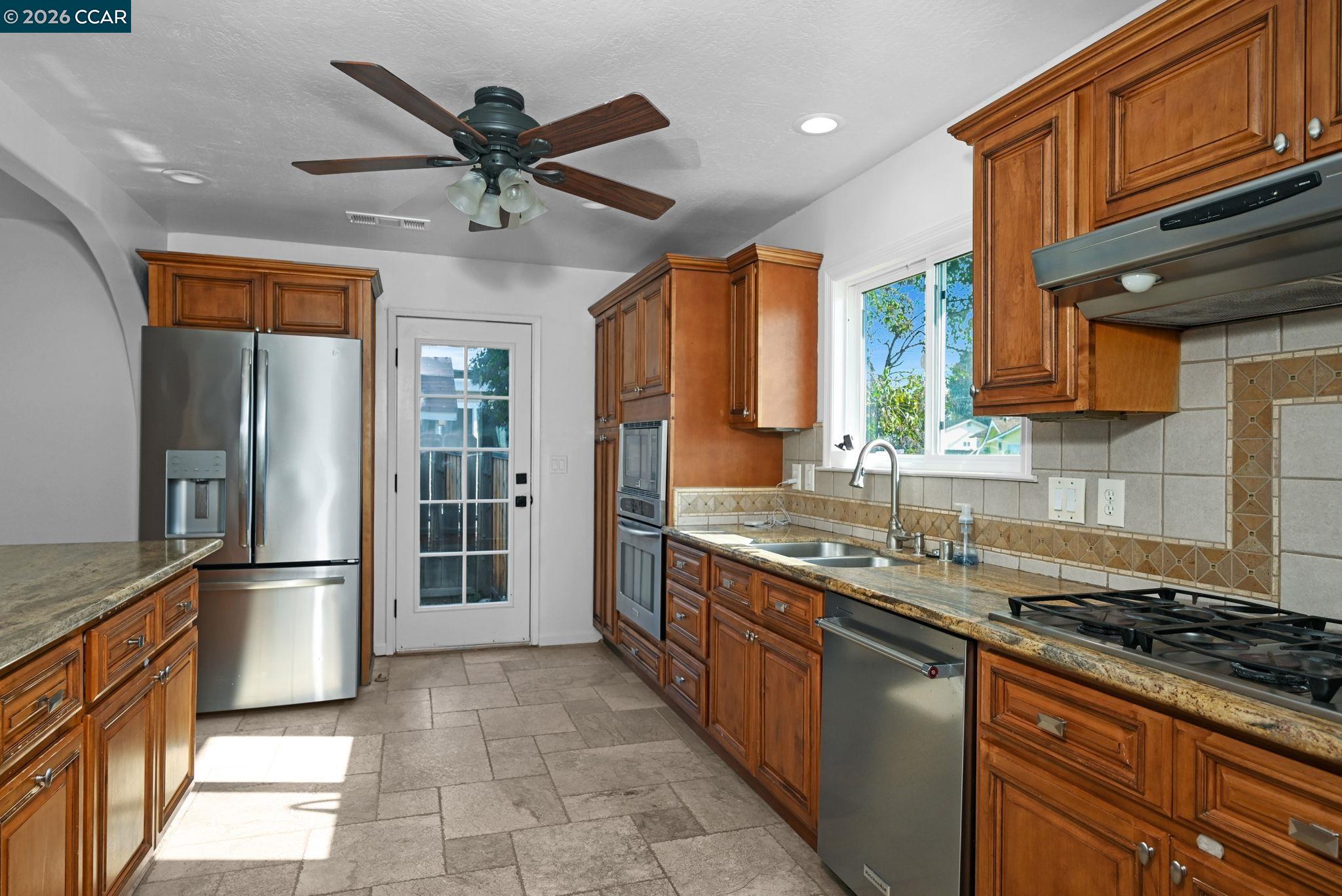 1921 Gilly Lane Concord, CA 94518 - Photo 6 of 29 a kitchen with stainless steel appliances granite countertop a sink stove and refrigerator