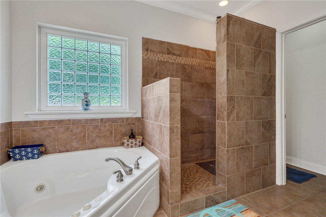 1186 Coopers Point Drive Northeast Townsend, GA 31331 - Photo 27 of 85 soaking tub and walk in tiled shower