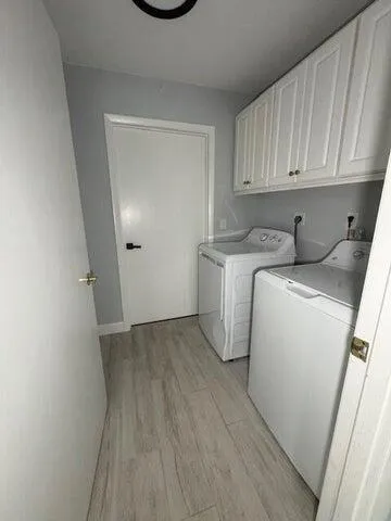 a view of a storage and utility room with a sink