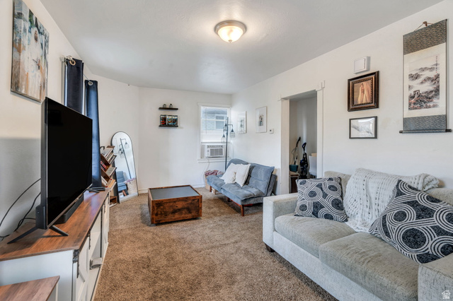 358 400 South Provo, UT 84601 - Photo 19 of 34 Carpeted living room with cooling unit.