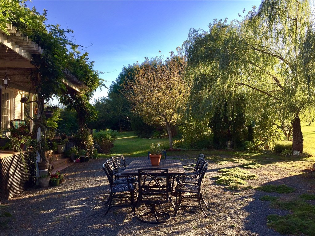 76 Hines Road Cumberland, RI 02864 - Photo 35 of 40 Magnificent Willow, Birch & Oak Trees Cascade the Outdoor Dining Area with Shade from the Afternoon Sun~