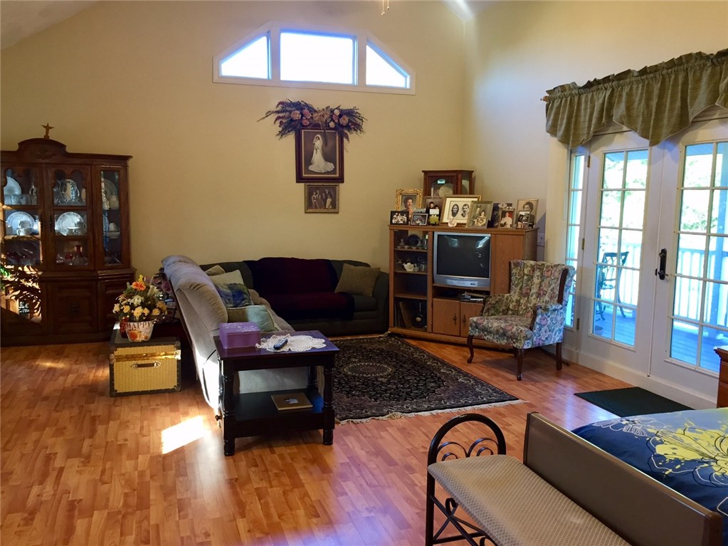76 Hines Road Cumberland, RI 02864 - Photo 8 of 40 Great Room with Cathedral Ceiling, French Doors Lead to Front Porch~