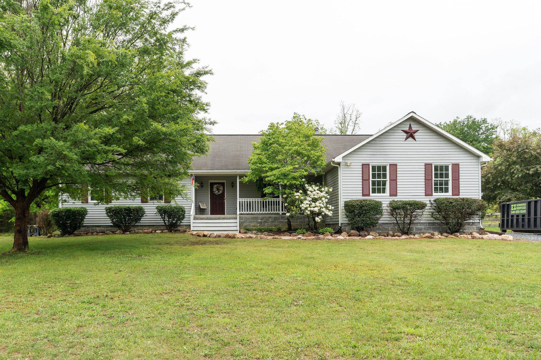 516 Estaline Valley Road Craigsville, VA 24430 - Photo 62 of 75 a view of a house with a yard and sitting area