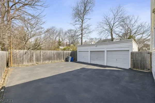 a view of a house with a yard and garage