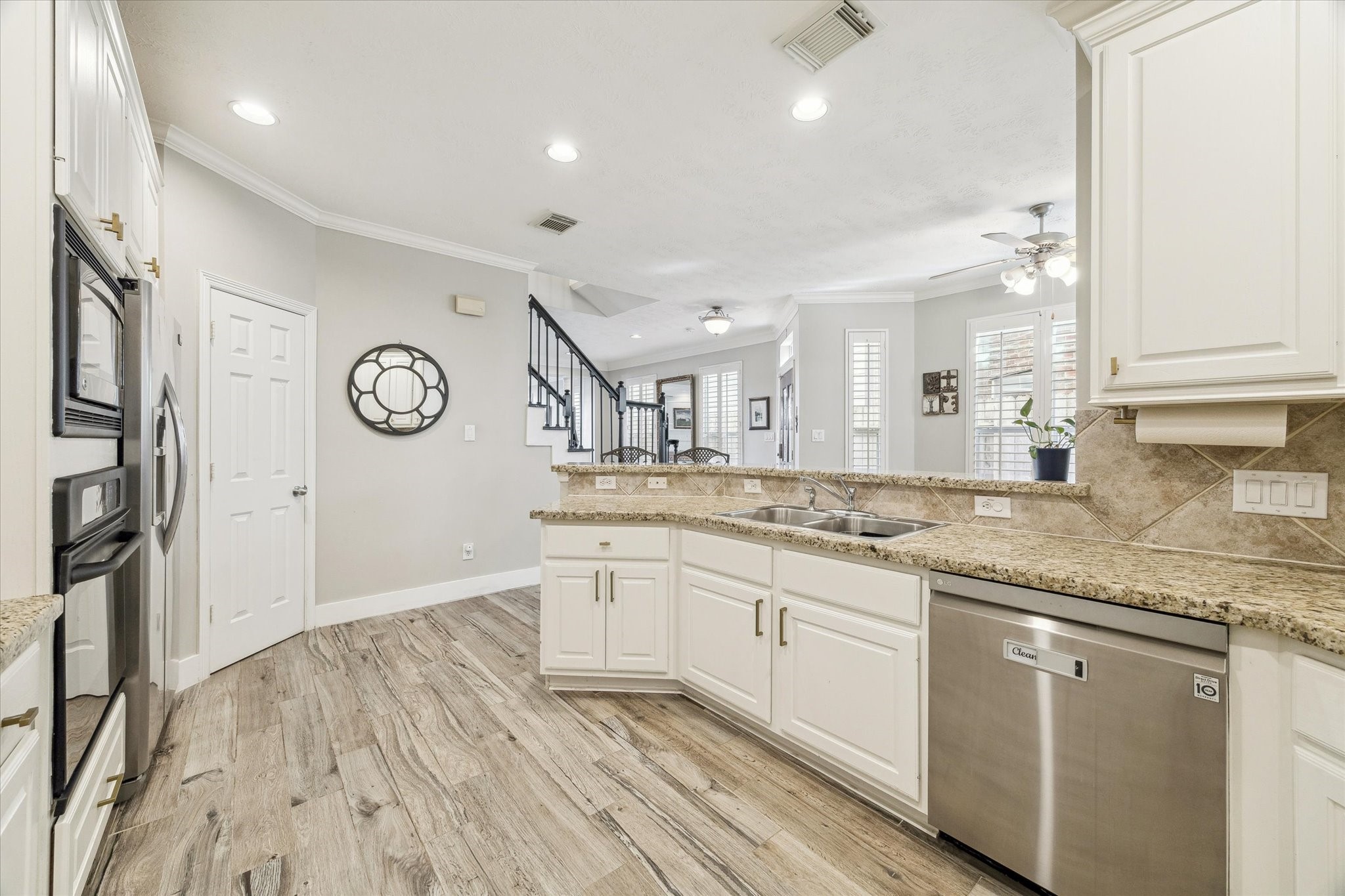 5242 Eigel Street Houston, TX 77007 - Photo 10 of 29 Modern kitchen with granite counters and stainless steel appliances.