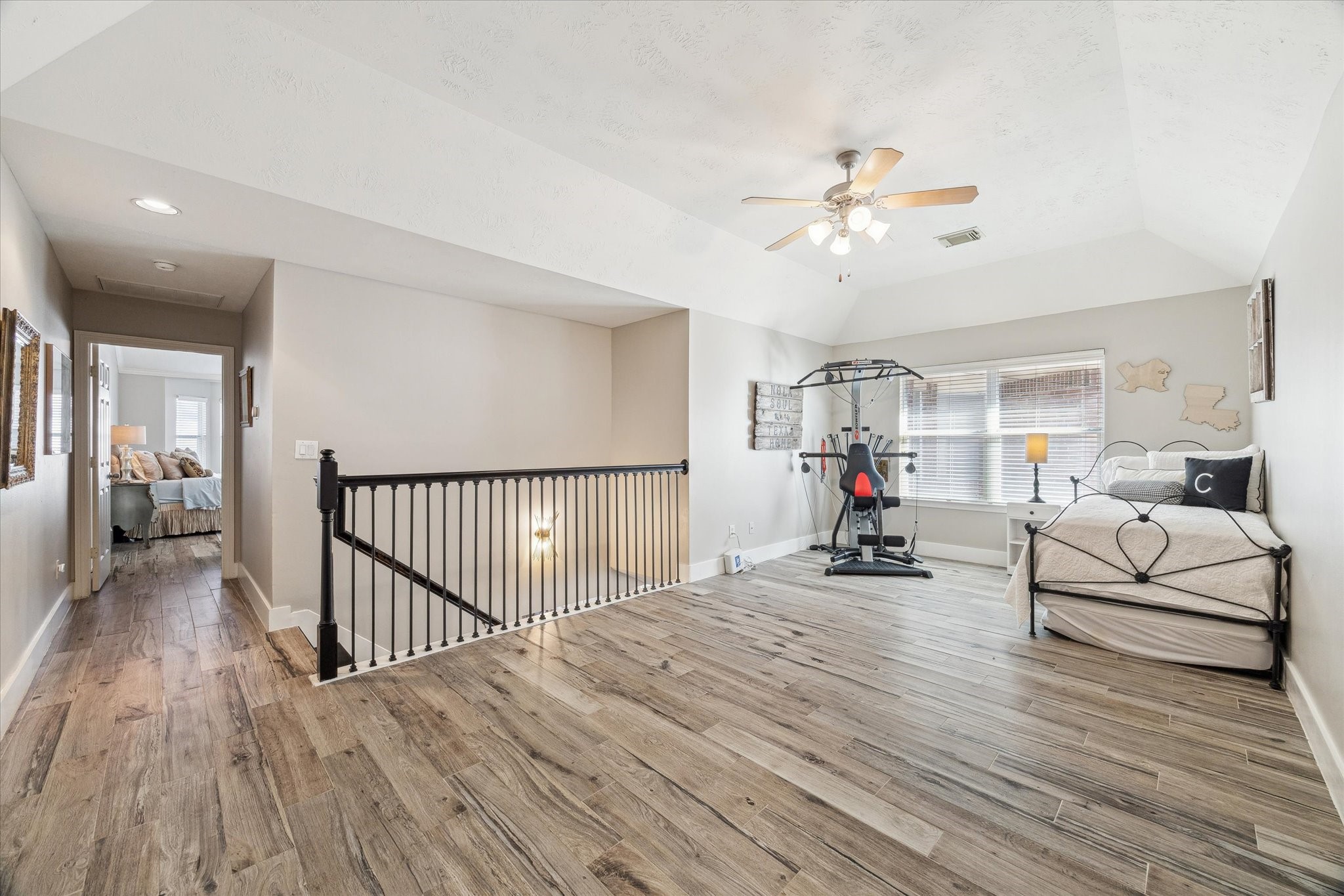 5242 Eigel Street Houston, TX 77007 - Photo 15 of 29 Spacious loft area with tons of natural light off of the primary bedroom.