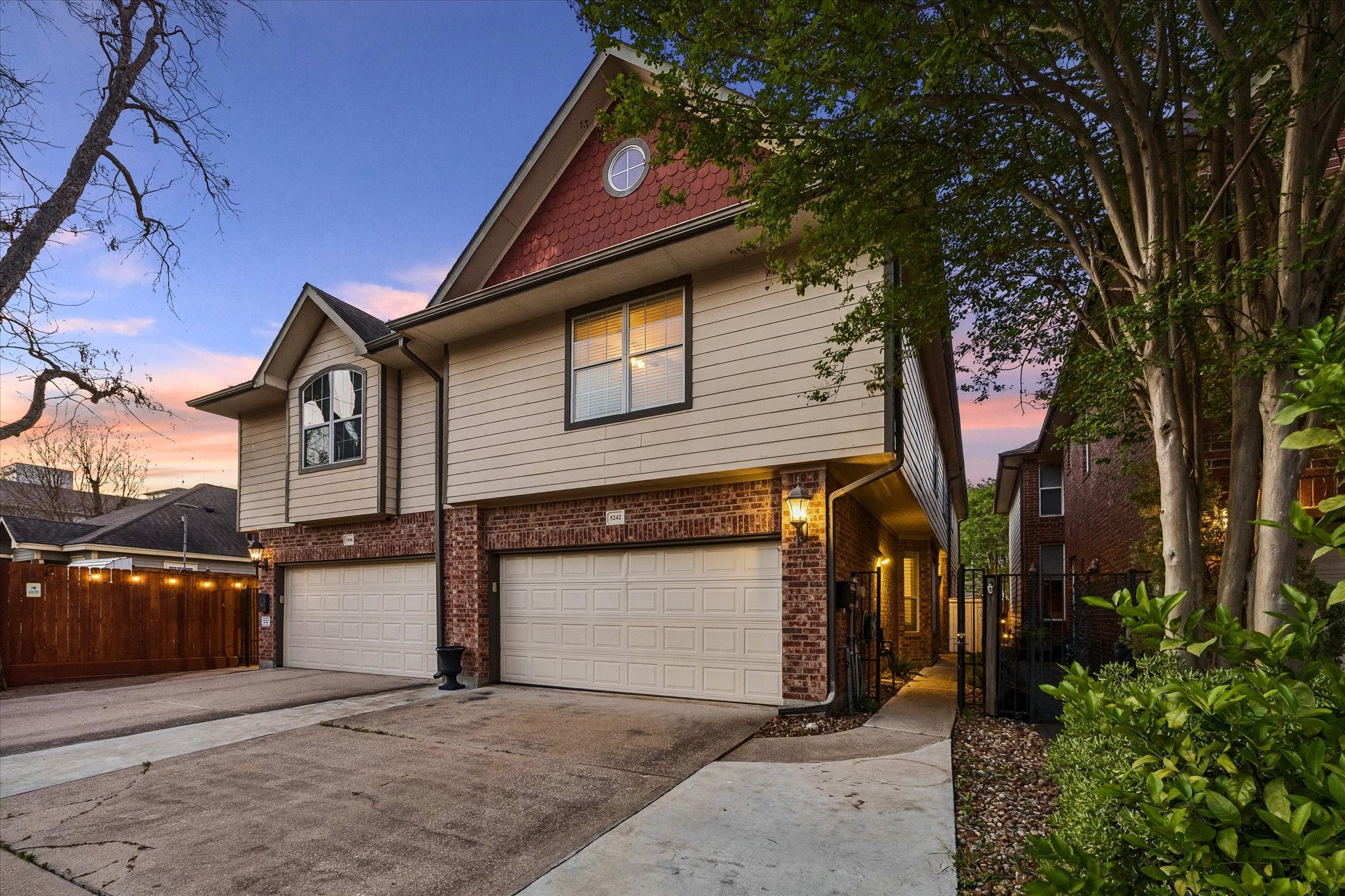 5242 Eigel Street Houston, TX 77007 - Photo 2 of 29 This inviting home features a private driveway leading to a spacious two-car garage, offering convenience and ample parking.
