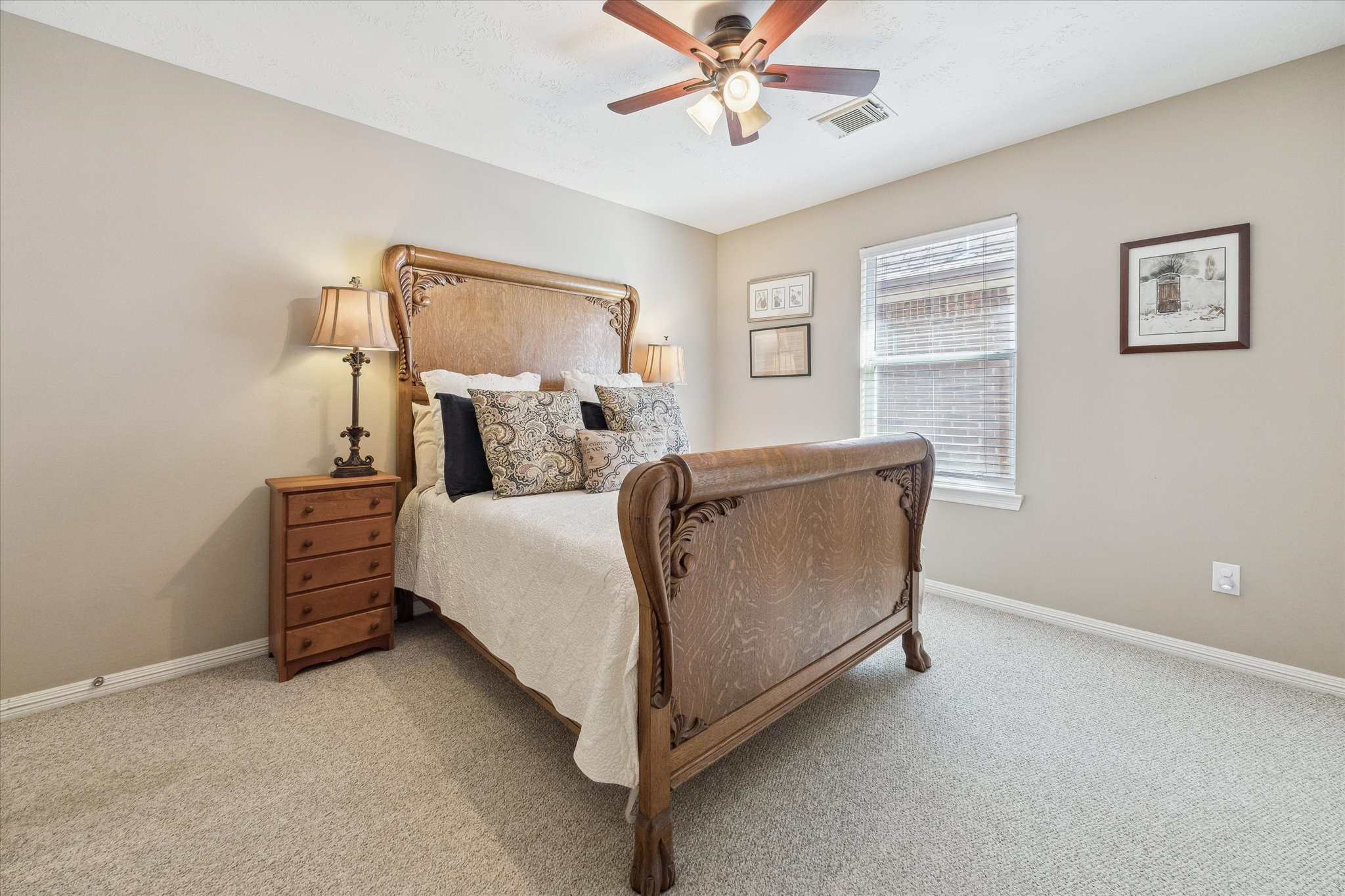 5242 Eigel Street Houston, TX 77007 - Photo 23 of 30 a bed room with a bed and a chandelier