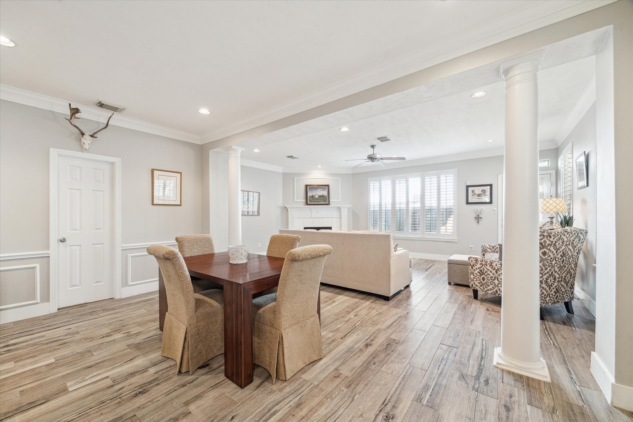 5242 Eigel Street Houston, TX 77007 - Photo 7 of 29 Formal dining area featuring elegant wood floors and ample natural light from large windows.