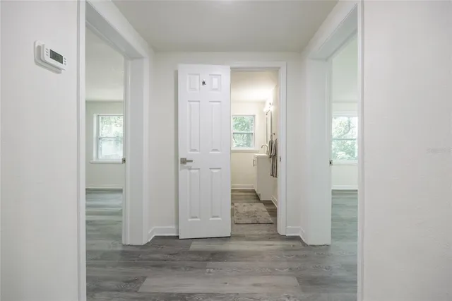 a view of a bathroom from a hallway