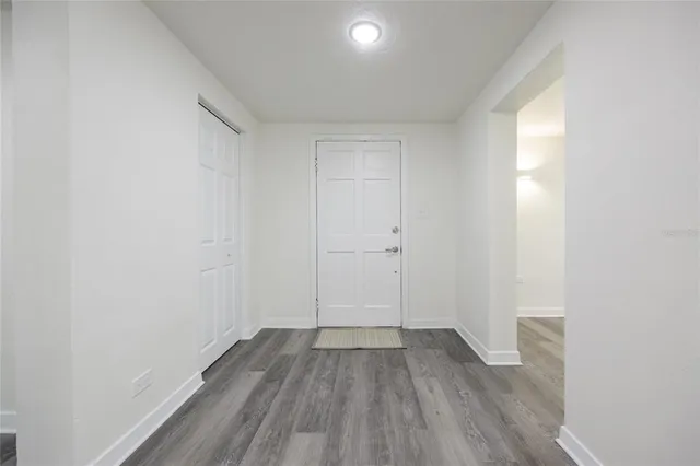 a view of room with wooden floor