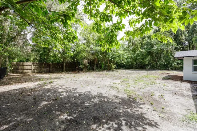 a backyard of a house with lots of green space
