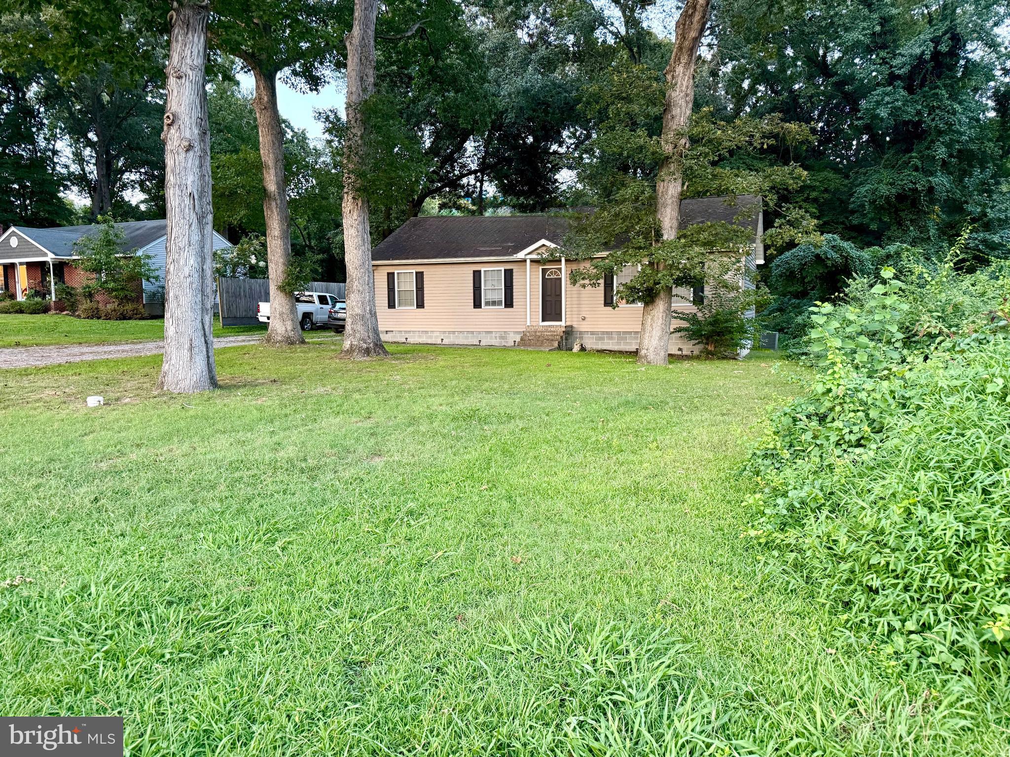 6209 Rockawalkin Road Salisbury, MD 21801 - Photo 11 of 37 a view of a house with backyard and a sitting area