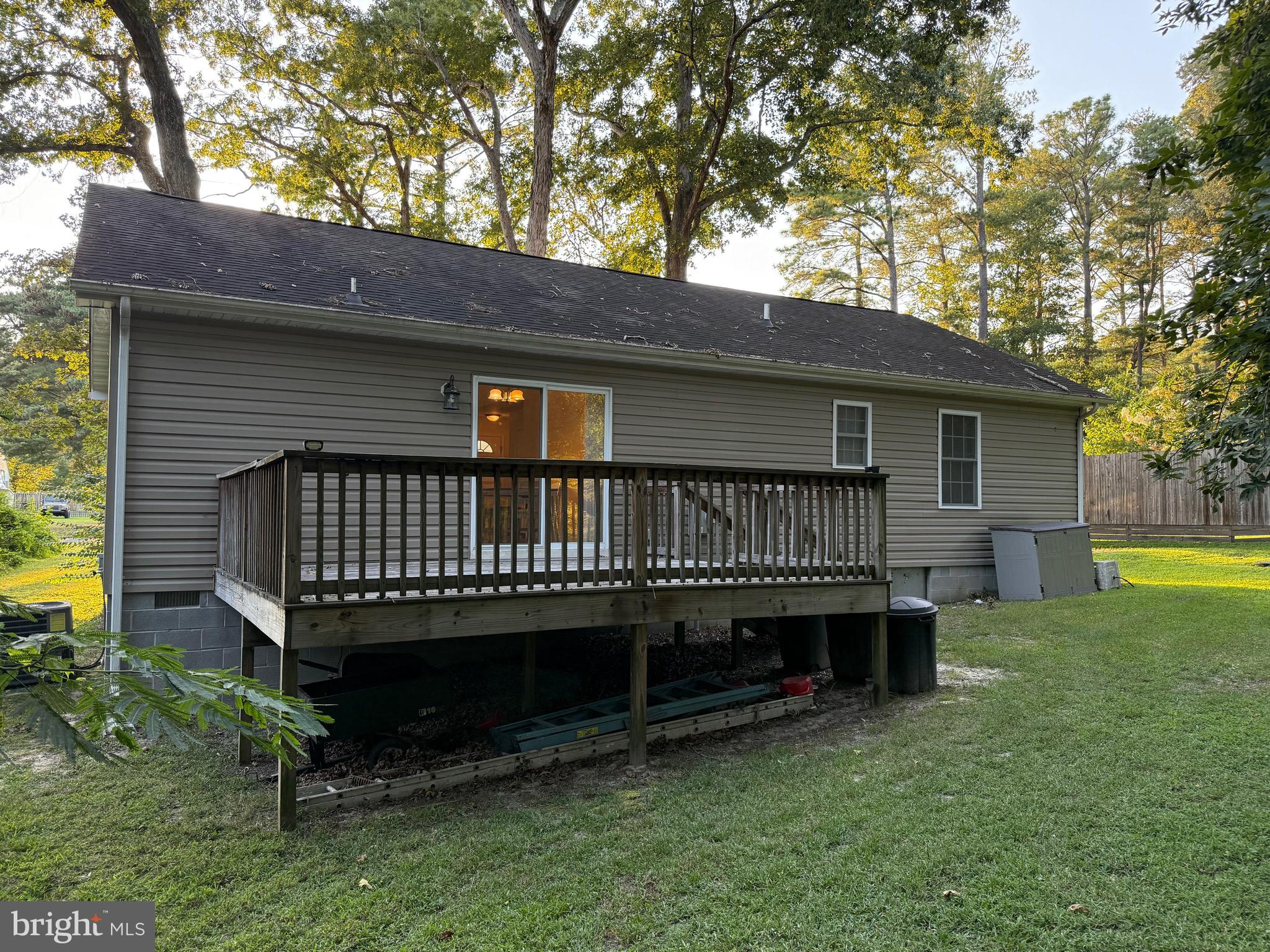 6209 Rockawalkin Road Salisbury, MD 21801 - Photo 14 of 37 a view of a house with a yard wooden fence and a large tree