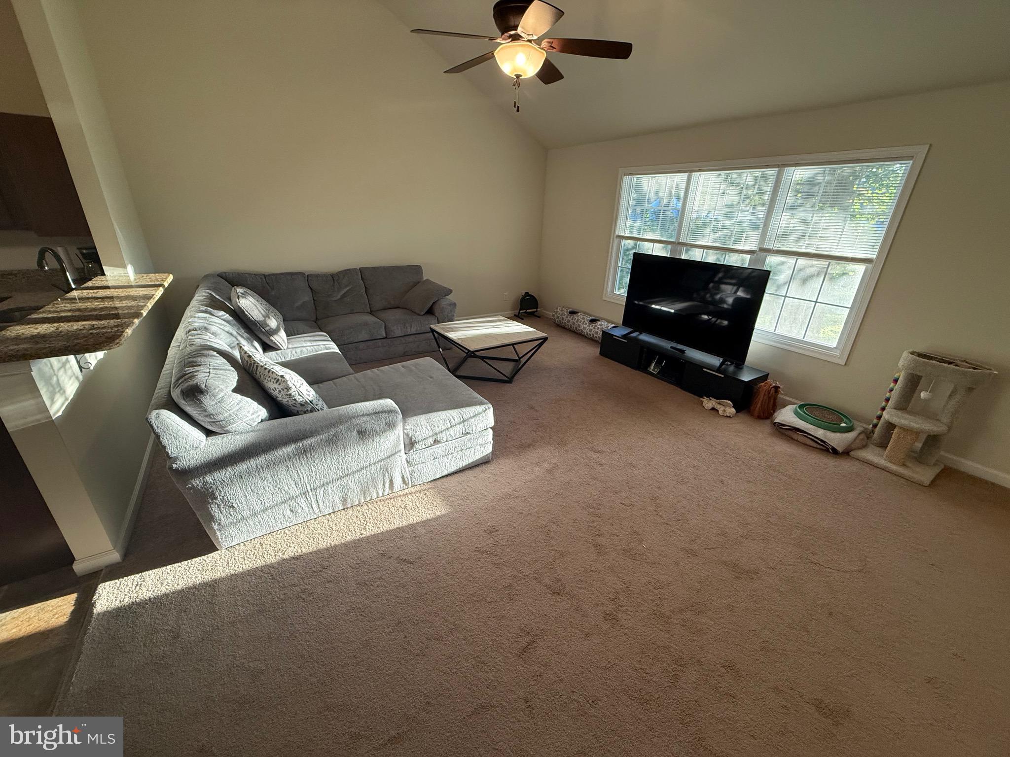 6209 Rockawalkin Road Salisbury, MD 21801 - Photo 26 of 37 a living room with furniture and a flat screen tv
