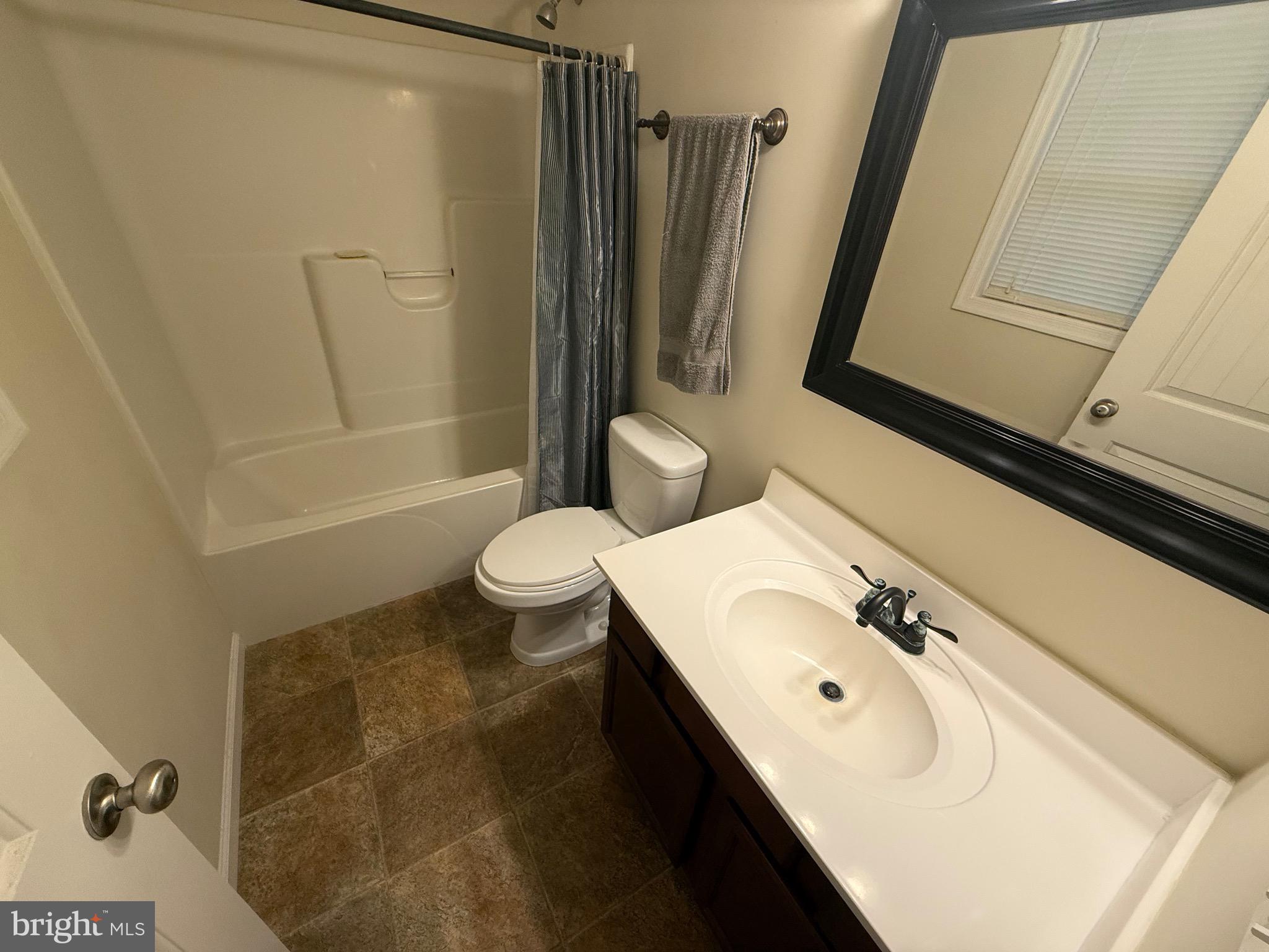 6209 Rockawalkin Road Salisbury, MD 21801 - Photo 28 of 37 a bathroom with a sink toilet and shower
