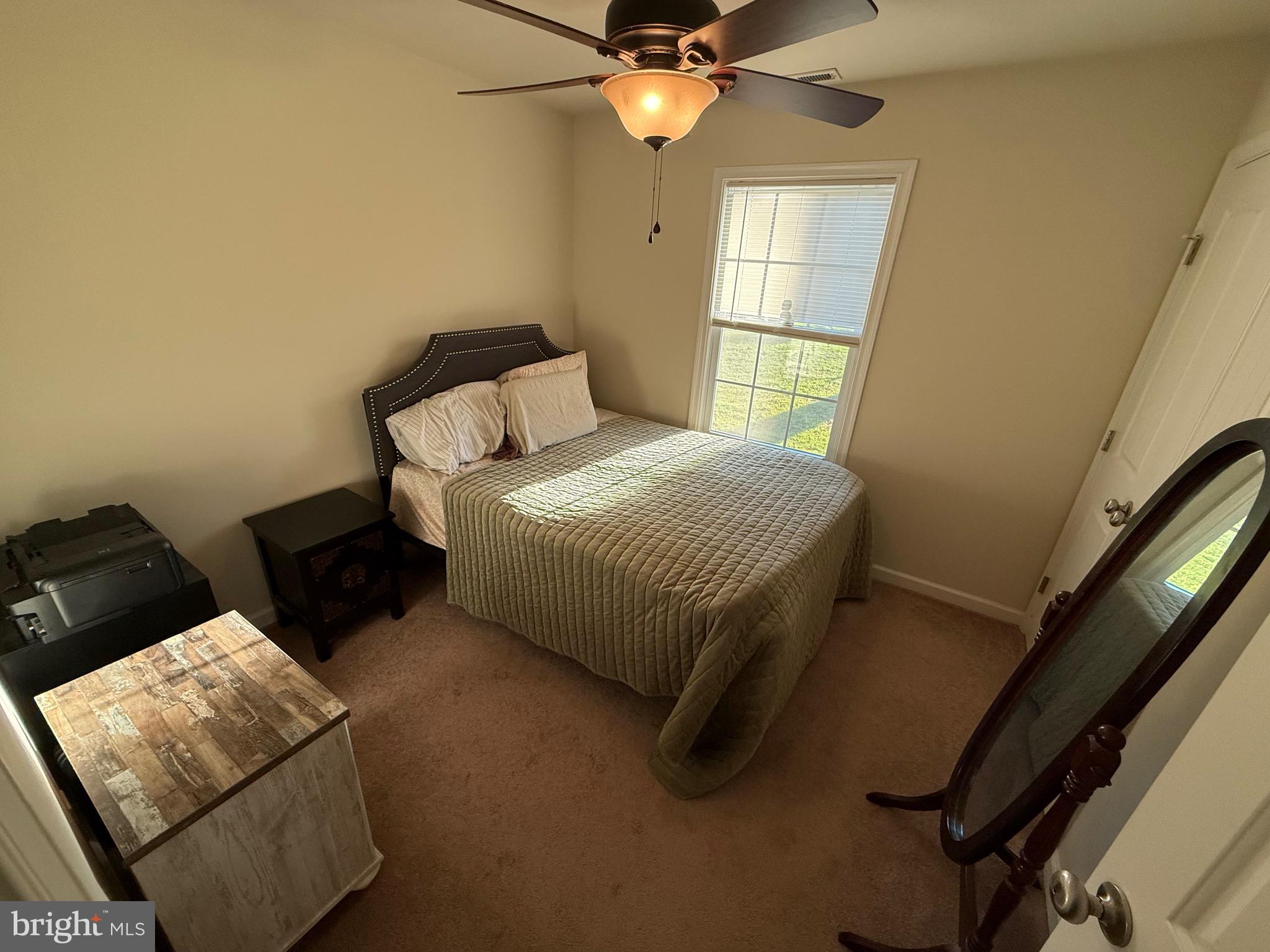 6209 Rockawalkin Road Salisbury, MD 21801 - Photo 32 of 37 a bedroom with a bed and window