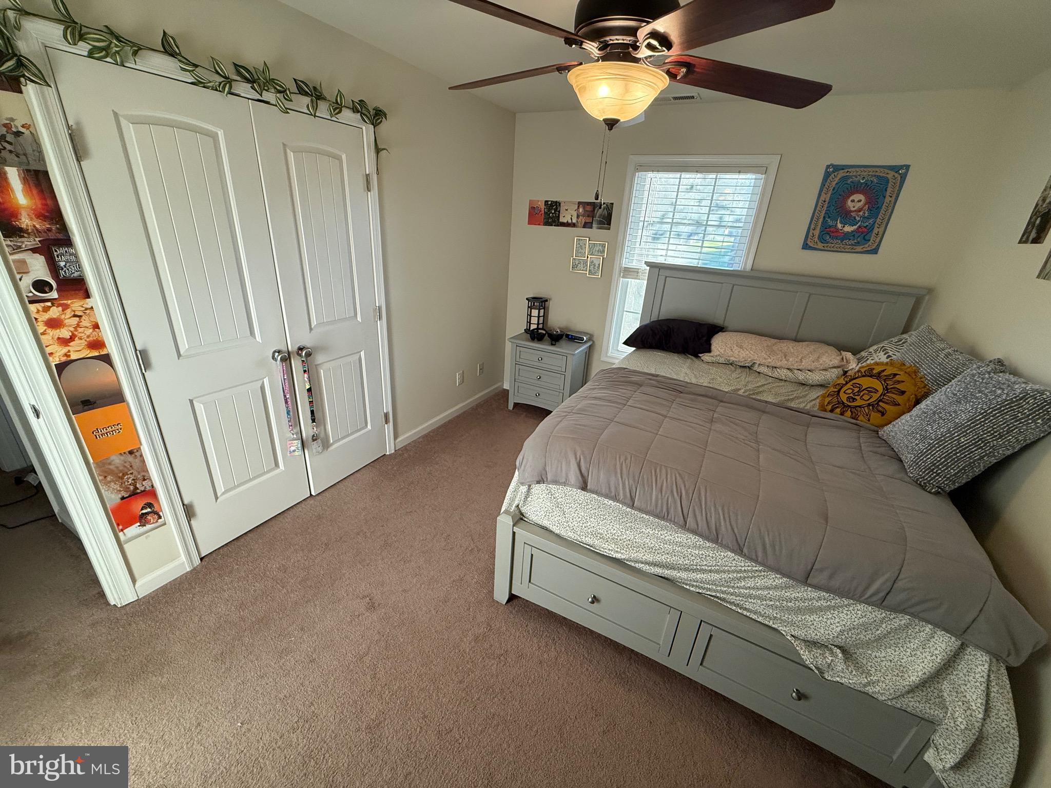 6209 Rockawalkin Road Salisbury, MD 21801 - Photo 34 of 37 a spacious bedroom with a bed and a chandelier