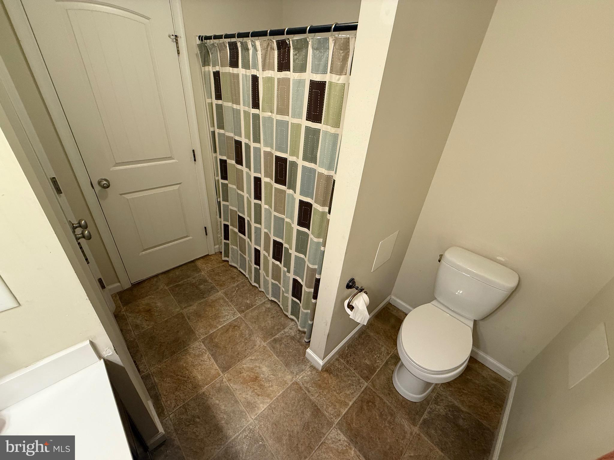 6209 Rockawalkin Road Salisbury, MD 21801 - Photo 36 of 37 a bathroom with a toilet and a shower