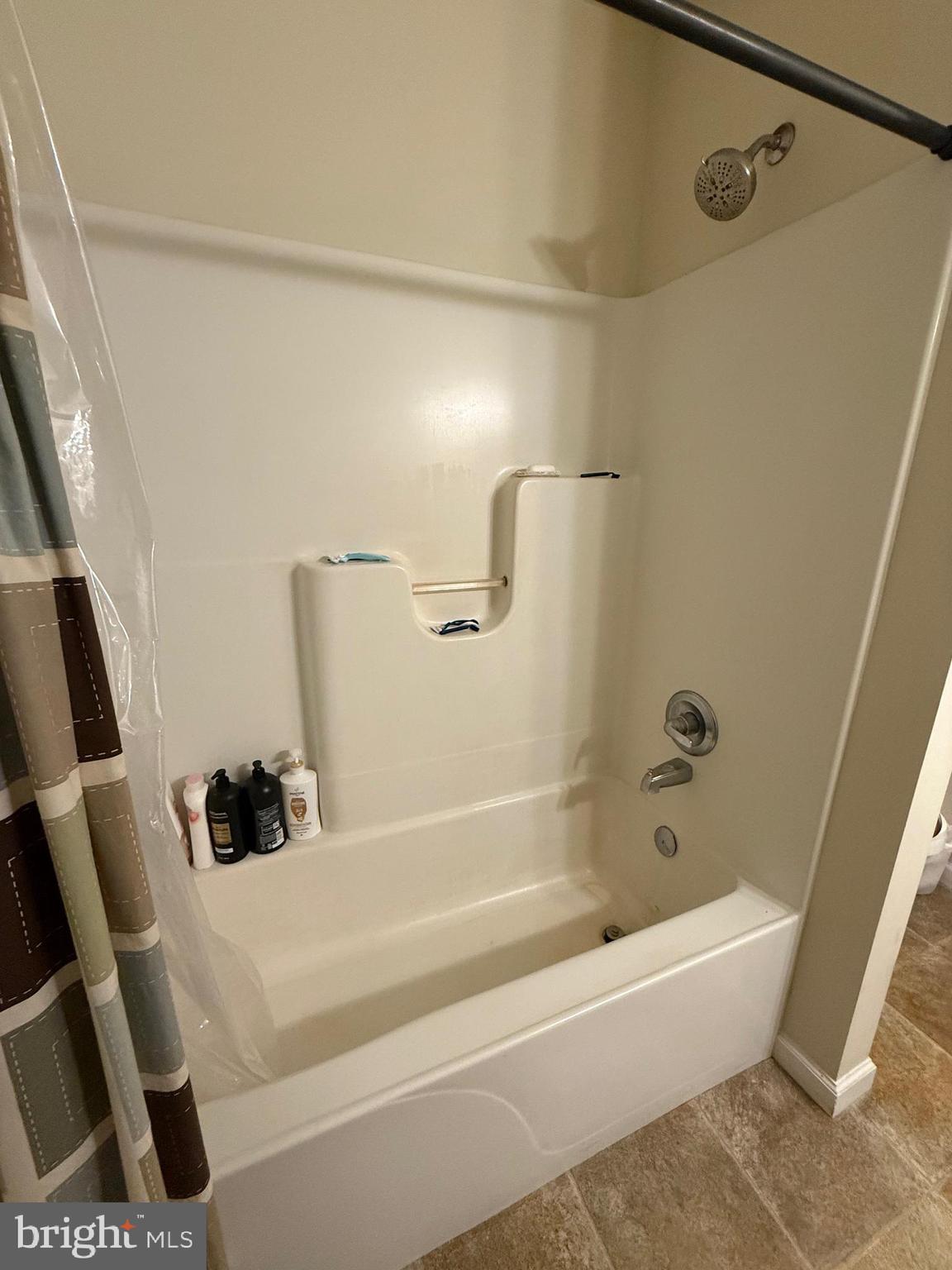 6209 Rockawalkin Road Salisbury, MD 21801 - Photo 37 of 37 a white bath tub sitting next to a white sink and vanity