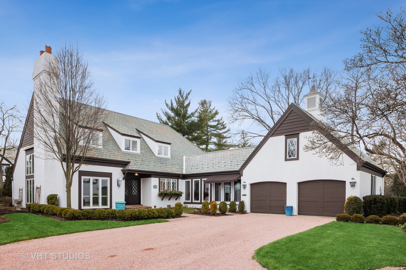 104 Burr Ridge Club Burr Ridge, IL 60527 - Photo 26 of 32 a front view of a house with a yard and trees