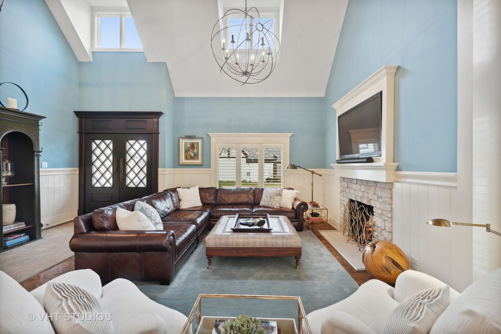 104 Burr Ridge Club Burr Ridge, IL 60527 - Photo 6 of 32 a living room with furniture fireplace and flat screen tv