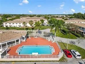 an aerial view of a house with a lake view