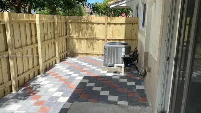 a view of a pathway with a backyard