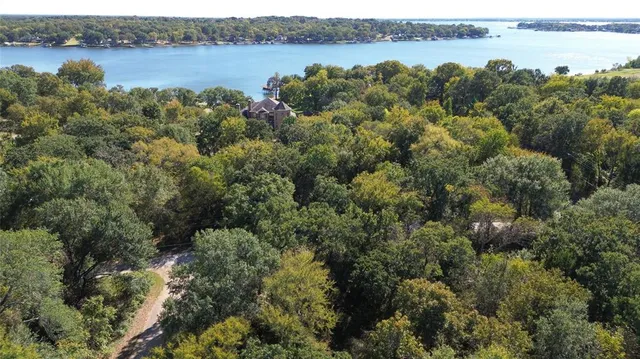 an aerial view of a houses with lake view