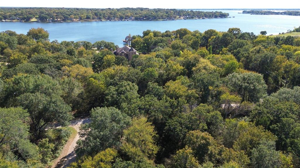 an aerial view of a houses with lake view