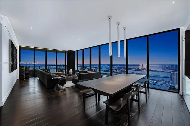 a view of a living room and kitchen with furniture