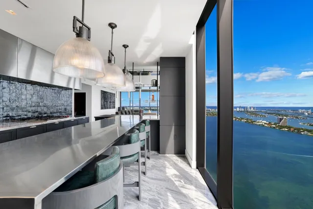 a kitchen with sink cabinets and stove