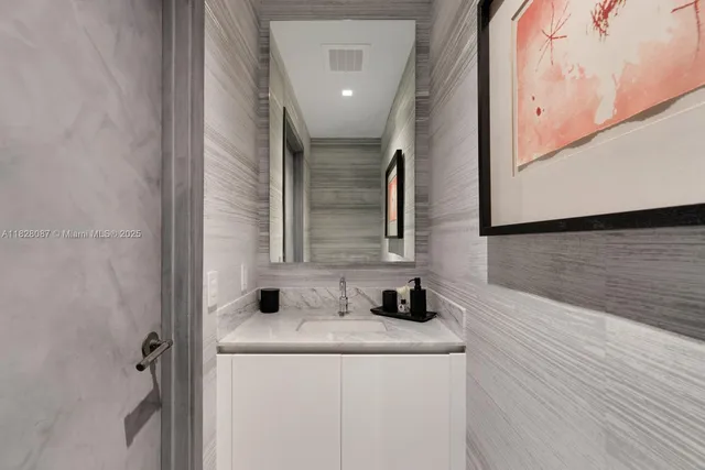 aerial view of a house with swimming pool and lake view