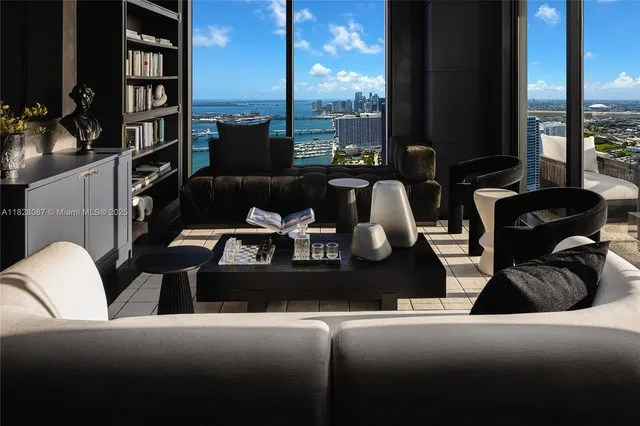 a kitchen with stainless steel appliances kitchen island granite countertop a sink and cabinets