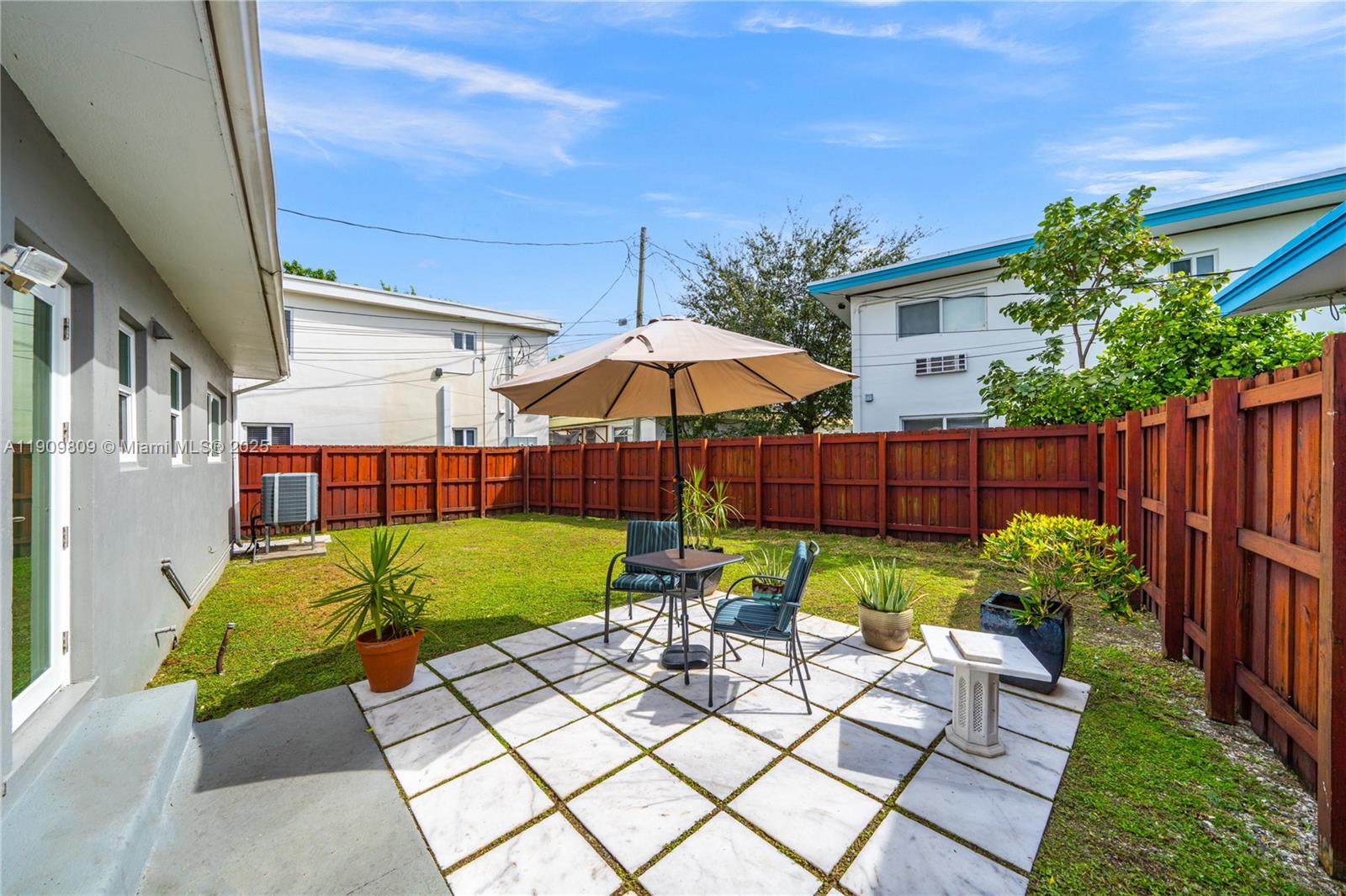 a view of yard with patio