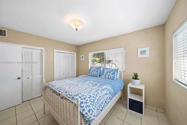 a bedroom with a bed and a table