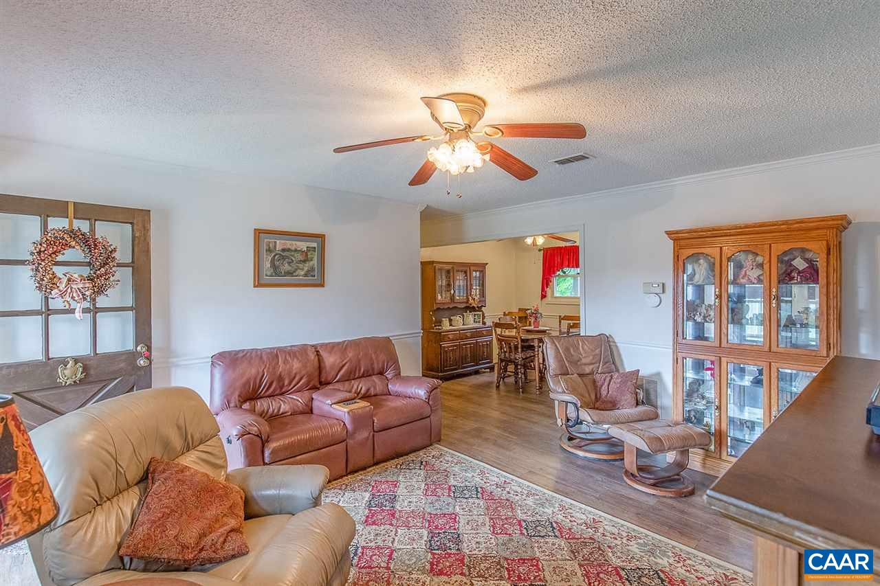 52 Morning Glory Road Ruckersville, VA 22968 - Photo 21 of 38 a living room with furniture a wooden floor and a window